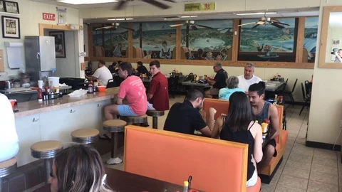 People having lunch at a diner Stock Footage 127124422