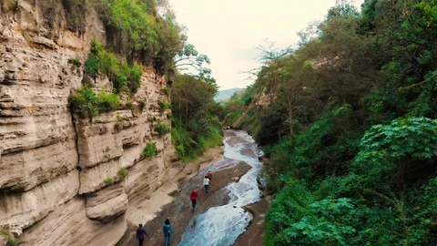 People Hike Through Devil's Bedroom in Nairobi Kenya, Africa. Stock Footage 91605159