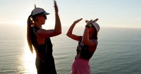 People, hiking and high five by ocean with hug, sunshine or check smart watch Stock Footage 332831546