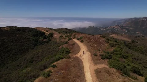 People hiking on trail in California Stock Footage 250281253