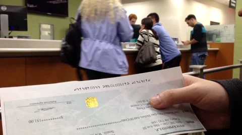 People holding a cheque inside TD Bank Stock Footage 54895214