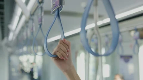 People holding a handle in a train While traveling to work. Safety while using p Stock Footage 145785833
