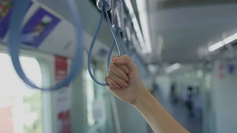 People holding a handle in a train While traveling to work. Safety while using p Stock Footage 145785852
