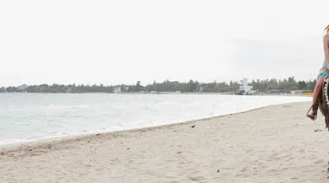 People Horseback On The Beach Stock-Footage 26176248