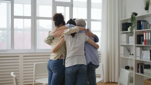 People hugging during support group meeting, battling with mental health issues Stock Footage 232295579