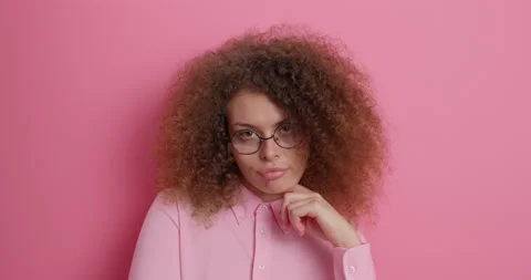 People human perception reaction concept. Hesitant curly haired woman spreads Stock Footage 150703078