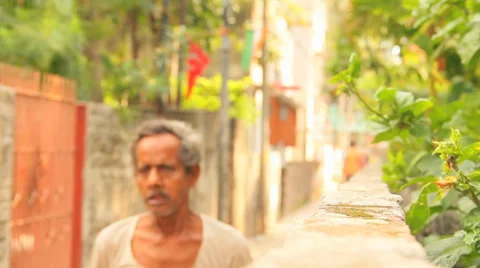 People in India walking through a narrow street in Kolkata Stock Footage 34509918