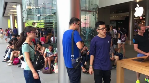 People inside the Apple Store at Genius Bar Stock Footage