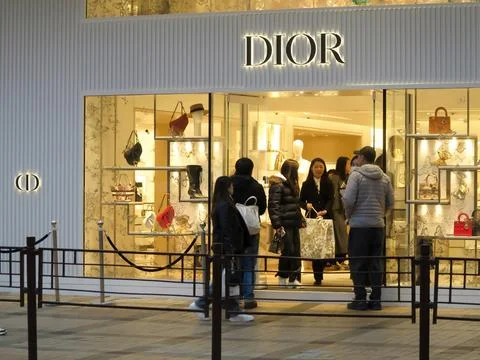 People inside Dior Flagship Store at Canton Road, Tsim Sha Tsui in Hong Kong. Stock Photos
