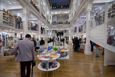 People inside library looking around at books Stock Photos