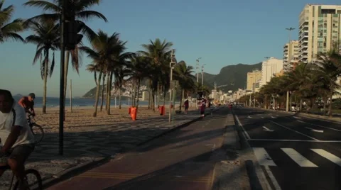 People jogging on footpath alongside beach Stock-Footage 51834724