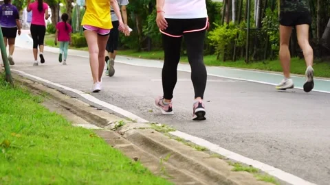 People jogging in the park in the evening Selective focus Stock Footage 171799849