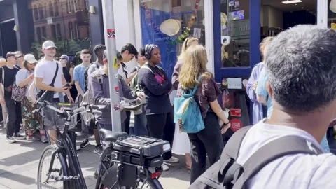 People join queue for specialist glasses for eclipse in Dublin Video stock 342045524