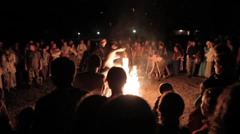 People Jump Over A Large Fire Stock Footage 53194770