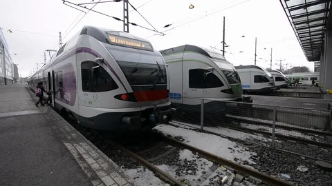 People jumping inside train,Helsinki main train station Stock Footage