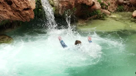 People Jumping into Stream Pool, Grand Canyon 動画素材 169262923