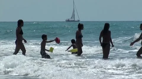 People jumping in waves Stock Footage 10809849