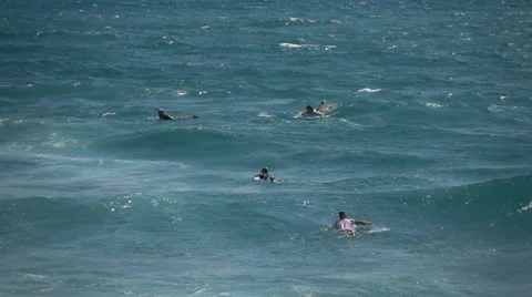 People jumping into waves, super slow motion Stock Footage 64107794