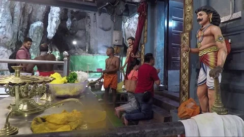 People kneeling for praying inside Hindu Temple, Main cave, Batu caves, Malaysia Stock Footage 196379002