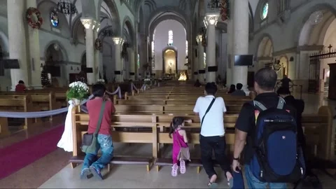 People kneeling for praying inside Manila Cathedral, Intramuros, Philippines Stock Footage 204057359