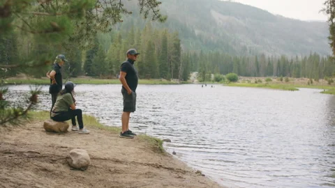 People at the lake in woods Stock Footage 167768983