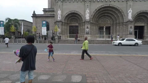 People launch Mechanical Flying Bird Toy, Square at Manila Cathedral, Intramuros Stock Footage 204058276