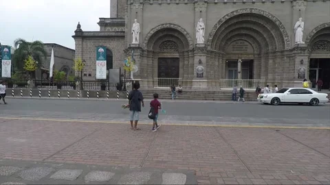 People launch Mechanical Flying Bird Toy, Square at Manila Cathedral, Intramuros Stock Footage 204058516