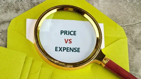 People learn about price and expense as they look at examples written on paper. Stock Footage 337004271