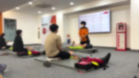 People learning CPR from firefighters, blurring Stock Footage 241377727