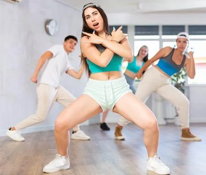 People learning swing steps at dance class and smiling Stock Photos