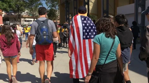 People leaving Olympic stadium hyperlapse with ending on American Flag Video stock 66793965