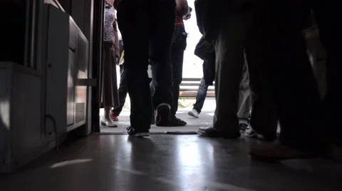 People leaving the train when it stopped at the station Stock Footage 60798827