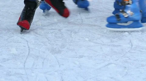 People legs close up while skating on ice rink Stock Footage 18045275