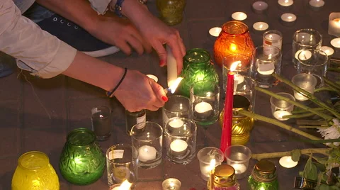 People light candles in memory of victims of the crash. Stock Footage 40270820