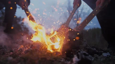 People light torches from the fire Stock Footage