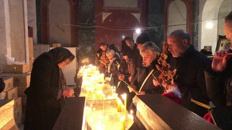 People lighting candles for the dead Stock Footage 124372230