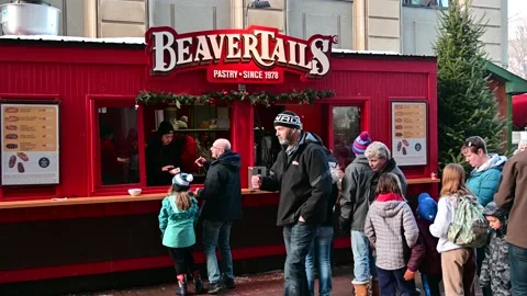 People Line Up in front of Beaver Tails Food Booth on Street, Downtown Ottawa Stock Footage 232959957