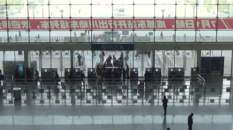 People line up a long queue and get in the ticket barrier of the waiting room Stock Footage 44839511