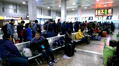 People line up a long queue and get through the ticket barrier Stock Footage 46839238