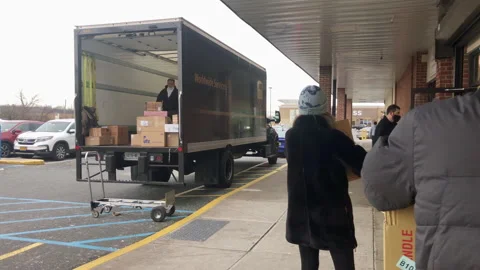 People on Line Outside The UPS Store While Truck is Loaded with Packages. Stock Footage 169331419