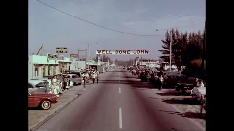 People line the streets to welcome return of astronaut John Glenn Stock Footage 262065063