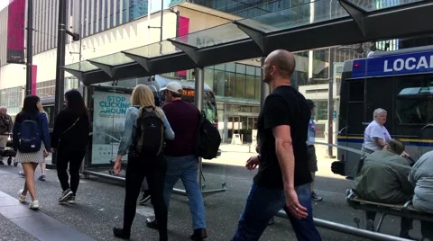 People line up for waiting bus Stock Footage 63252272
