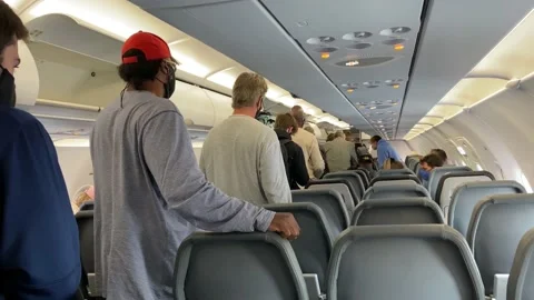 People in line waiting to get off of a p... | Stock Video | Pond5