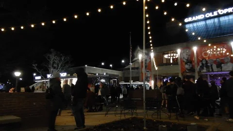 People Lined Up At Night Waiting Outside To Go Into The Grand Ole Opry House Stock Footage 129757258