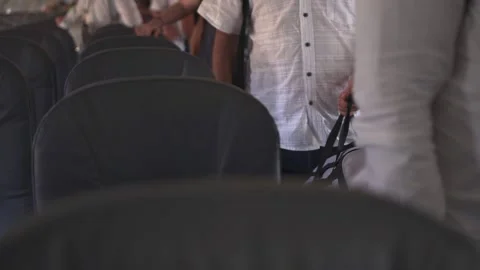 People lining up to get off the plane Stock Footage 158332509