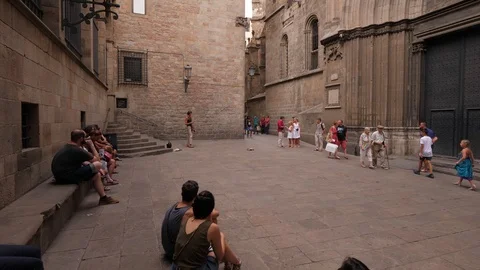 People listen actors singing operating aria at small square next to Cathedral Video stock 95987283