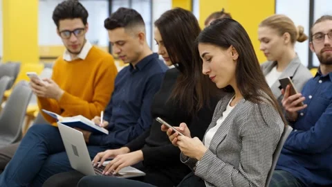 People listen presenter, make notes in gadgets on business meeting conference Stock Footage 196916378