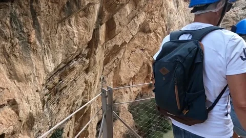 People looking down the gorge, river below, Caminito del Rey Video stock 220741572