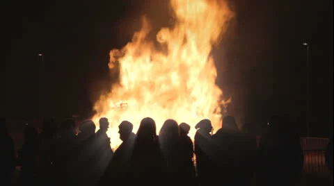 People looking at a fire at easter Stock Footage 24462859