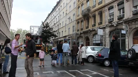 People looking on fire fighting action - Lyon, France Stock Footage 44753268